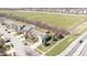 An aerial view showcasing a suburban home near well-maintained sports fields and tree-lined streets at 5944 Edelle Dr, Indianapolis, IN 46237