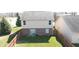 Aerial view of a fenced backyard, showcasing a neat lawn and the rear elevation of the home at 5944 Edelle Dr, Indianapolis, IN 46237