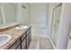 A primary bathroom features double sinks, soaking tub, and glass shower at 5944 Edelle Dr, Indianapolis, IN 46237