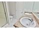 Bright bathroom featuring double sinks and vanity with stone-look countertops at 5944 Edelle Dr, Indianapolis, IN 46237