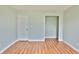 Bedroom with wood floors and a closet at 5944 Edelle Dr, Indianapolis, IN 46237