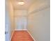A walk-in closet with wood-look floor is illuminated by a light fixture at 5944 Edelle Dr, Indianapolis, IN 46237