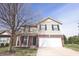 Charming two-story home with a brick-accented facade, black shutters, and an attached two-car garage at 5944 Edelle Dr, Indianapolis, IN 46237
