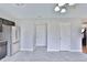 Open kitchen area featuring stainless steel refrigerator and easy access to other rooms at 5944 Edelle Dr, Indianapolis, IN 46237