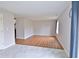 Bright living room showcasing wood and tile flooring, light gray walls, and ample natural light at 5944 Edelle Dr, Indianapolis, IN 46237