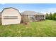 A spacious backyard with a storage shed and well-maintained grass at 7236 Sunset Point Dr, Indianapolis, IN 46259