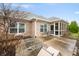 The home features a screened in porch and concrete patio with chairs in a well-maintained backyard at 7236 Sunset Point Dr, Indianapolis, IN 46259