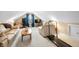 Bright bonus room featuring carpet, sloped ceilings, a treadmill, and comfortable seating at 7236 Sunset Point Dr, Indianapolis, IN 46259