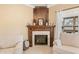 Cozy fireplace with a wooden mantle, tile surround, and decorative accents at 7236 Sunset Point Dr, Indianapolis, IN 46259