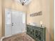 Entryway boasts decorative console table, chandelier and a welcome wall decor at 7236 Sunset Point Dr, Indianapolis, IN 46259