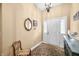 Bright foyer featuring a decorative mirror, chandelier, and console table at 7236 Sunset Point Dr, Indianapolis, IN 46259