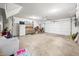 Spacious garage with ample storage, overhead lighting, and an automatic garage door at 7236 Sunset Point Dr, Indianapolis, IN 46259
