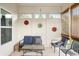 Charming porch with comfortable blue seating, decorative accents, and ample natural light at 7236 Sunset Point Dr, Indianapolis, IN 46259