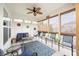Charming sunroom with a ceiling fan, cozy seating, and natural light streaming through the windows at 7236 Sunset Point Dr, Indianapolis, IN 46259