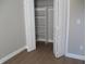 White shelved closet with wood-look flooring at 769 E Pearl St, Whiteland, IN 46184