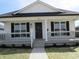 Charming home with inviting front porch and manicured landscaping at 769 E Pearl St, Whiteland, IN 46184