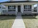 Charming home with inviting front porch and manicured landscaping at 769 E Pearl St, Whiteland, IN 46184