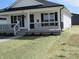 Charming home with a covered porch, black shutters, and a freshly landscaped front yard at 769 E Pearl St, Whiteland, IN 46184
