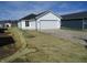 Attached garage and gravel driveway for the property at 769 E Pearl St, Whiteland, IN 46184