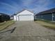 New garage with fresh gravel driveway for the home at 769 E Pearl St, Whiteland, IN 46184