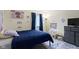 Bright bedroom featuring neutral walls, a plush bed, and decor at 7965 Benjamin Dr, Lawrence, IN 46226
