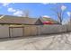 View of the fenced backyard and parking area at 7965 Benjamin Dr, Lawrence, IN 46226