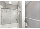 Neutral toned bathroom featuring glass shower doors and sleek fixtures at 8077 Foxchase Dr, Indianapolis, IN 46256