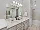 The bathroom features double sinks and a large mirror at 8077 Foxchase Dr, Indianapolis, IN 46256