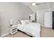 A bedroom with a nightstand, bed and attached bathroom at 8077 Foxchase Dr, Indianapolis, IN 46256