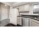 Modern kitchen featuring stainless steel appliances, granite countertops, and ample cabinet space at 8077 Foxchase Dr, Indianapolis, IN 46256