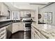 Bright kitchen featuring stainless appliances, granite countertops, and eat in kitchen table at 8077 Foxchase Dr, Indianapolis, IN 46256