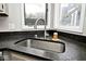 Close-up of a kitchen sink and countertop, showing modern fixtures and a bright window at 8077 Foxchase Dr, Indianapolis, IN 46256