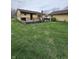 Exterior view of house with a well-kept lawn and dark wood deck at 839 S Paddock Rd, Greenwood, IN 46143