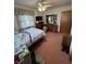 Bedroom featuring vintage decor, closet and view of yard at 839 S Paddock Rd, Greenwood, IN 46143