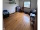 Bright bedroom featuring hardwood floors, closet and window at 839 S Paddock Rd, Greenwood, IN 46143