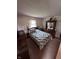 Bedroom featuring vintage decor, dresser and window at 839 S Paddock Rd, Greenwood, IN 46143