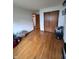 Bright bedroom featuring hardwood floors, closet and window at 839 S Paddock Rd, Greenwood, IN 46143