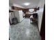 Functional kitchen with wooden cabinetry, a dining area, and durable vinyl flooring at 839 S Paddock Rd, Greenwood, IN 46143