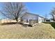 Backyard featuring a wooden deck and a large tree, offering a great space for outdoor relaxation at 888 Streamside Dr, Greenfield, IN 46140