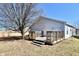 Backyard wooden deck perfect for outdoor entertaining with a tree at 888 Streamside Dr, Greenfield, IN 46140