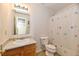 Bathroom featuring vanity, mirror, and shower with flowered curtain at 888 Streamside Dr, Greenfield, IN 46140
