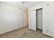 Cozy bedroom featuring neutral carpet, white walls, closet, and a ceiling fan at 888 Streamside Dr, Greenfield, IN 46140