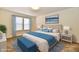 This bedroom is complete with a large bed with a blue blanket and matching bench at 888 Streamside Dr, Greenfield, IN 46140