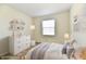 Cozy bedroom with decor, a comfortable bed, and bright natural light at 888 Streamside Dr, Greenfield, IN 46140