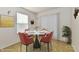 Inviting dining room with round table, place settings, floral arrangement, and butterfly wall decor at 888 Streamside Dr, Greenfield, IN 46140