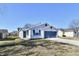 Charming single-story home with a well-maintained lawn and a two-car garage at 888 Streamside Dr, Greenfield, IN 46140