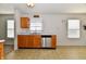 Bright kitchen area with stainless steel dishwasher, neutral floor tiles, and decor at 888 Streamside Dr, Greenfield, IN 46140