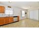 Bright eat-in kitchen featuring wood cabinets and stainless steel dishwasher and sink at 888 Streamside Dr, Greenfield, IN 46140