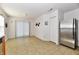 Kitchenette area with stainless steel refrigerator and linoleum flooring at 888 Streamside Dr, Greenfield, IN 46140