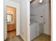 Laundry room with washer and dryer next to full bathroom at 888 Streamside Dr, Greenfield, IN 46140